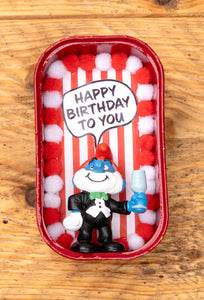 „Happy Birthday to you" Dose mit Schlumpf mit Sektglas im Smokin